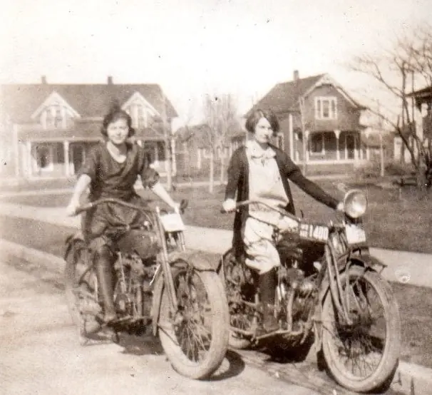 Old image of two women on motorcycles